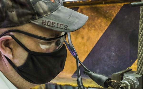 Engineering Technician Shane Buzby Loads a CCU-148/B Impulse Cartridge into a MLU-57/B Cutter Body