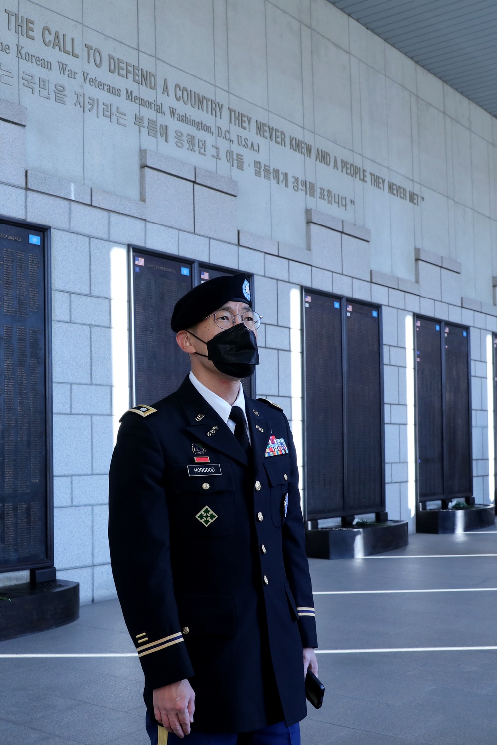 Lt. Col. Hobgood stands with the names of fallen soldiers