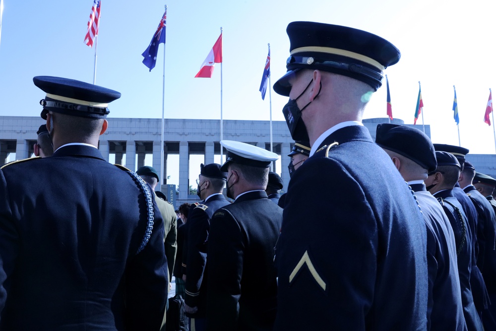 UNC watch the memorial ceremony during Turn Toward Busan