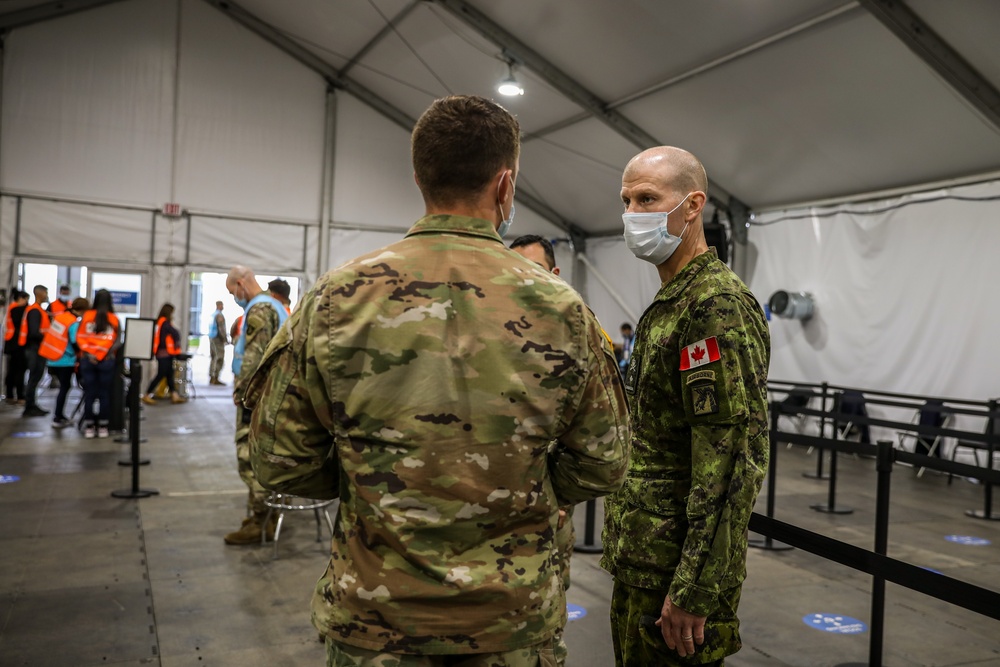 Canadian Army Brig. Gen. R.T. Ritchie, Assistant Commanding General of Operations, XVIII Airborne Corps visits the United Center COVID-19 Community Vaccination Center, Chicago