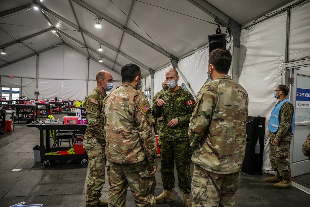 Canadian Army Brig. Gen. R.T. Ritchie, Assistant Commanding General of Operations, XVIII Airborne Corps visits the United Center COVID-19 Community Vaccination Center, Chicago