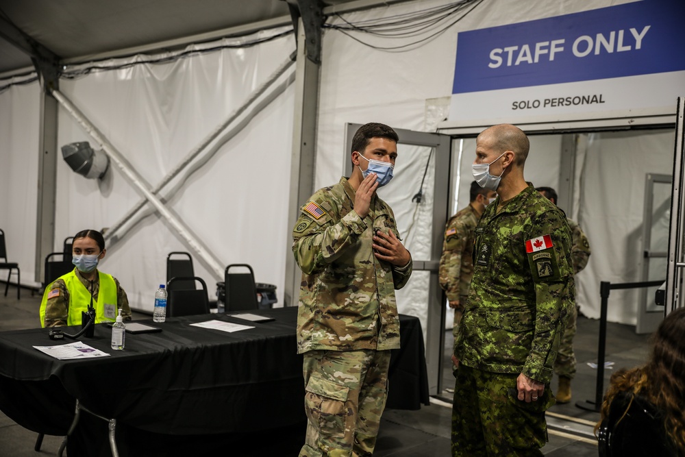 Canadian Army Brig. Gen. R.T. Ritchie, Assistant Commanding General of Operations, XVIII Airborne Corps visits the United Center COVID-19 Community Vaccination Center, Chicago