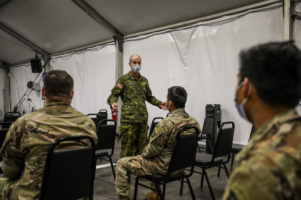 Canadian Army Brig. Gen. R.T. Ritchie, Assistant Commanding General of Operations, XVIII Airborne Corps visits the United Center COVID-19 Community Vaccination Center, Chicago