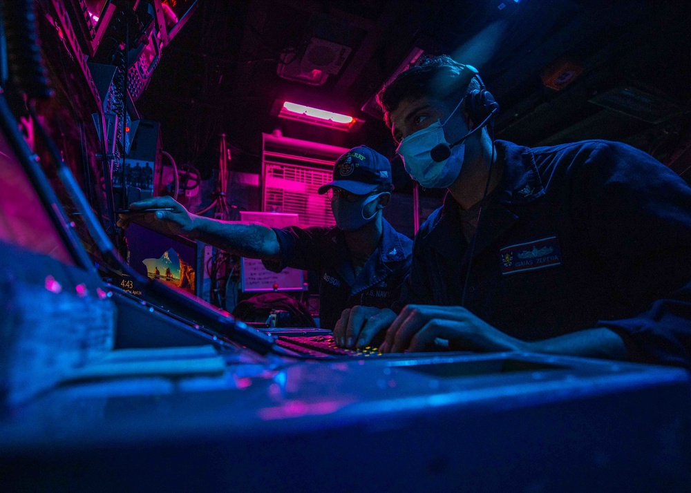 CTT2 Brandon Gibson and CTT3 Isais Zepeda stand the Electronic Warfare Supervisor watch aboard the USS Barry
