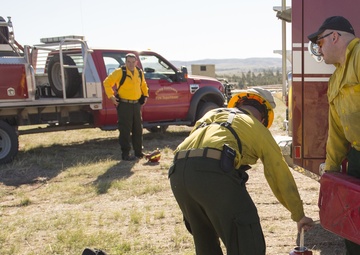 Camp Guernsey prepares for fire season with prescribed burn and bucket drop exercise