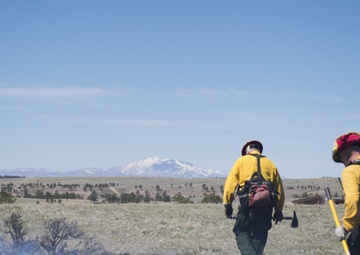 Camp Guernsey prepares for fire season with prescribed burn and bucket drop exercise