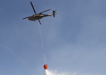 Camp Guernsey prepares for fire season with prescribed burn and bucket drop exercise