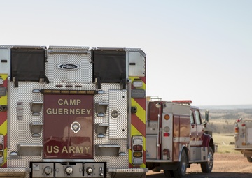 Camp Guernsey prepares for fire season with prescribed burn and bucket drop exercise