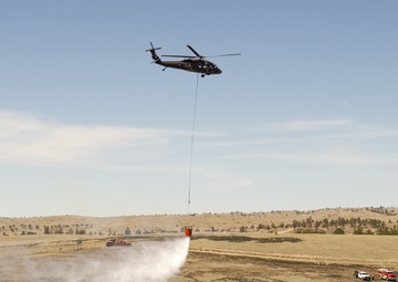 Camp Guernsey prepares for fire season with prescribed burn and bucket drop exercise