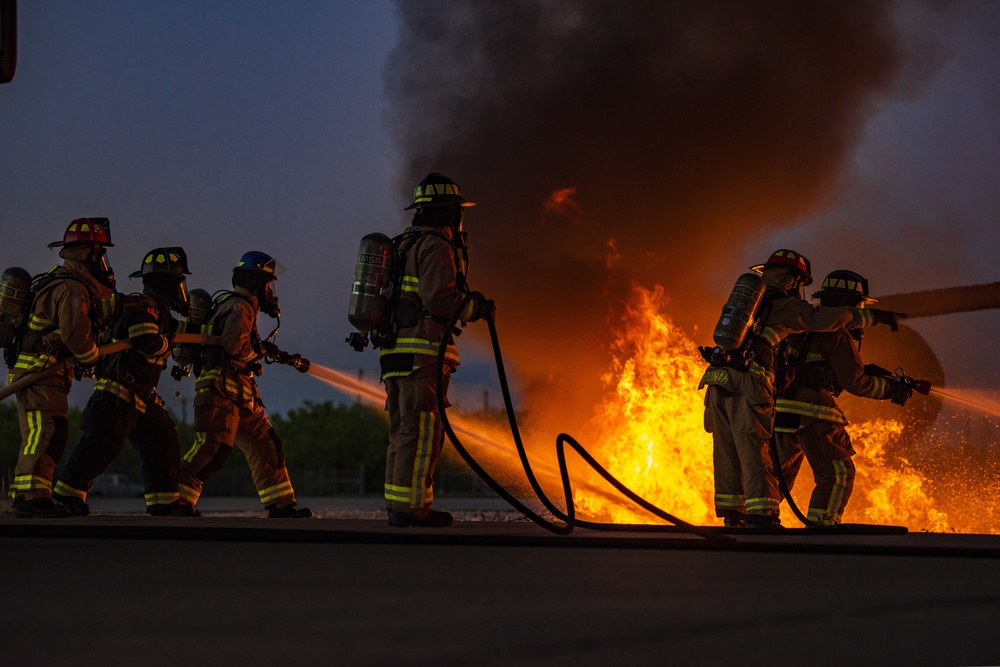 Aircraft fire training; 7th CES, 512th CES and Abilene Regional Airport firefighters team up