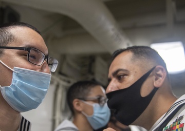 USS America (LHA 6) Sailors Conduct Dress White Uniform Inspections.
