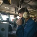 Sailor tests communication system equipment.