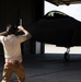 90th AMU Airman directs F-22 Raptor for maintenance
