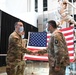 Staff Sgt. Chase Warren reenlists at the Michael Jordan statue at the United Center COVID-19 Community Vaccination Center, Chicago