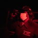Seaman Nogoye Ndiaye scans for surface contacts on the bridge wing of USS Barry