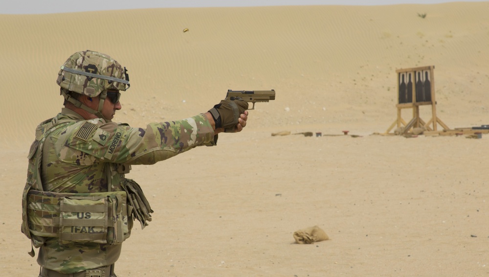 Staff Sgt. Aaron Merono, 36th Infantry Division, competes in Task Force Spartan small arms marksmanship competition