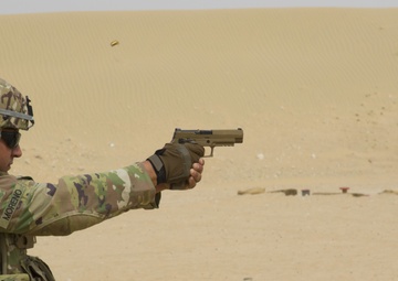 Staff Sgt. Aaron Merono, 36th Infantry Division, competes in Task Force Spartan small arms marksmanship competition