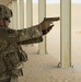 Command Sgt. Maj. Jim Horn, 36th Infantry Division, Task Force Spartan, shoots after TF Spartan small arms marksmanship competition