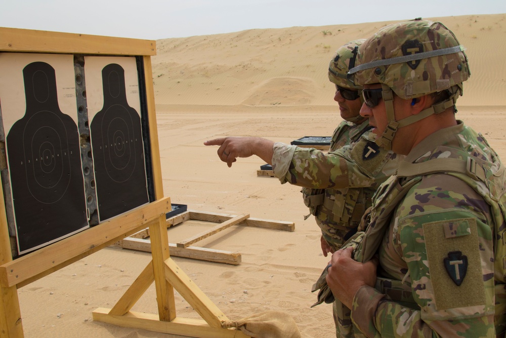 36th Infantry Division, Task Force Spartan, Soldiers check their targets after shooting in TF Spartan small arms competition