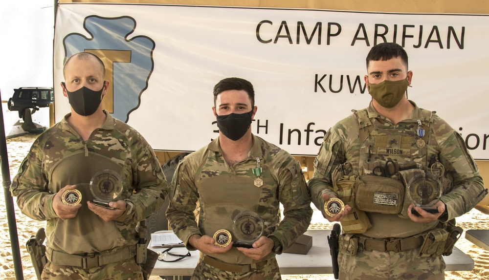 The winners of the Task Force Spartan 2nd Annual Small Arms Marksmanship Competition pose with their commendations