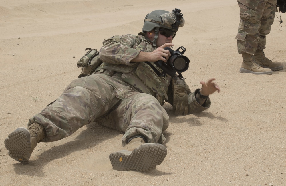 Unit Public Affairs Representatives from Task Force Spartan train on using cameras at small arms competition