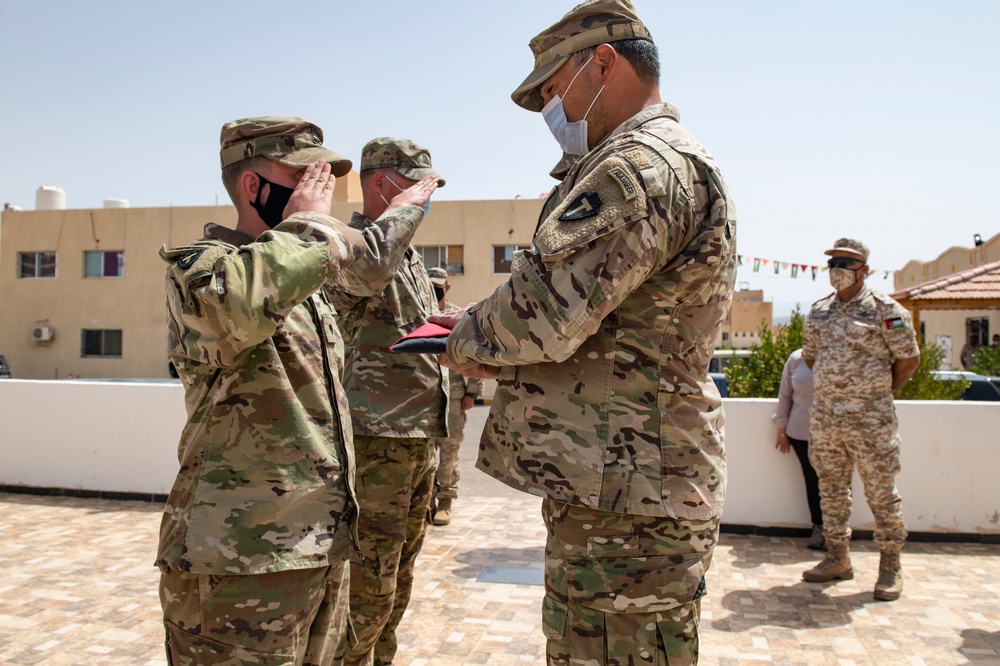 Desert Warrior 21 Participants Exchange Flags in Ceremony
