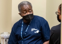 81 year-old retired Army nurse helps with vaccines