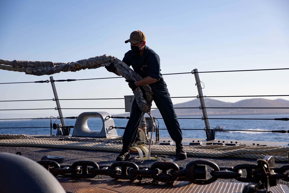 U.S. Navy Sailor Handles Lines as USS Sioux City Arrives at Naval Station Guantanamo Bay, Cuba