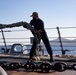 U.S. Navy Sailor Handles Lines as USS Sioux City Arrives at Naval Station Guantanamo Bay, Cuba