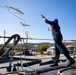 U.S. Navy Sailor Throws Over Lines as USS Sioux City Arrives at Naval Station Guantanamo Bay, Cuba