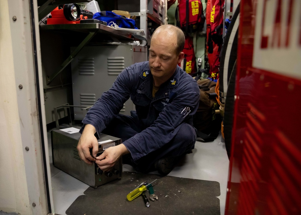 U.S. Navy Sailor Conducts Maintenance on a Data Acquisition Unit on USS Sioux City