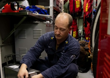 U.S. Navy Sailor Conducts Maintenance on a Data Acquisition Unit on USS Sioux City