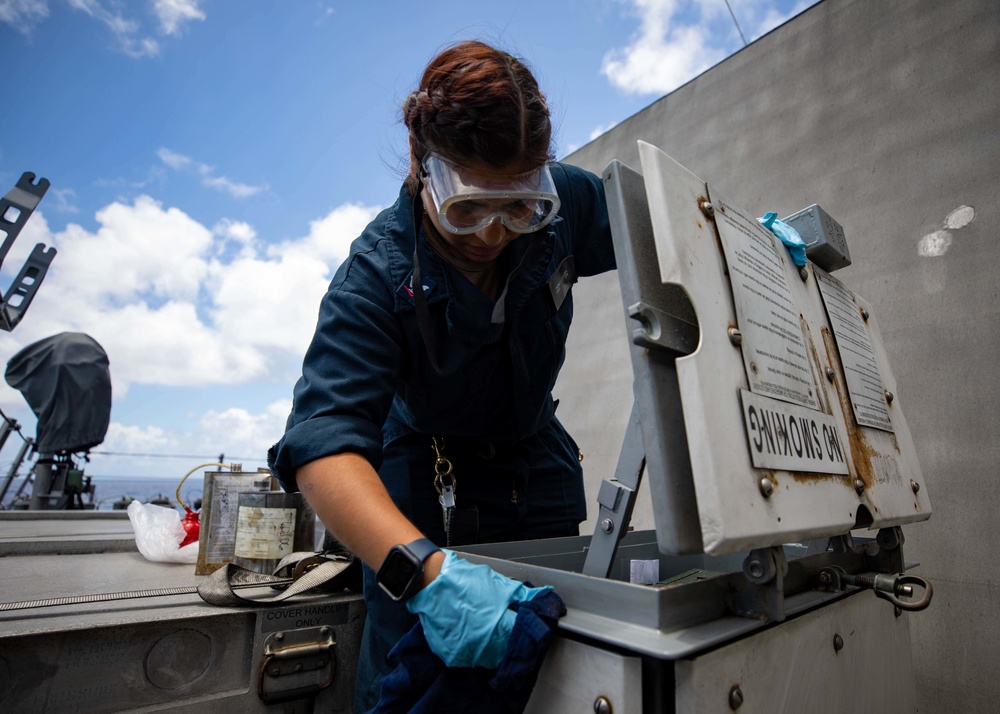 U.S. Navy Sailor Conducts Maintenance on a Ready Service Locker on USS Sioux City