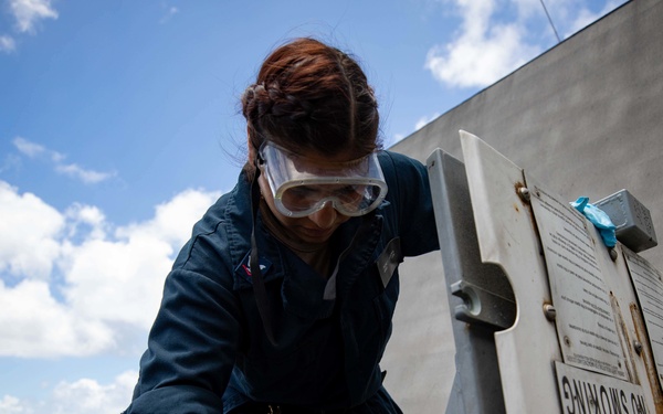 U.S. Navy Sailor Conducts Maintenance on a Ready Service Locker on USS Sioux City