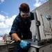 U.S. Navy Sailor Conducts Maintenance on a Ready Service Locker on USS Sioux City