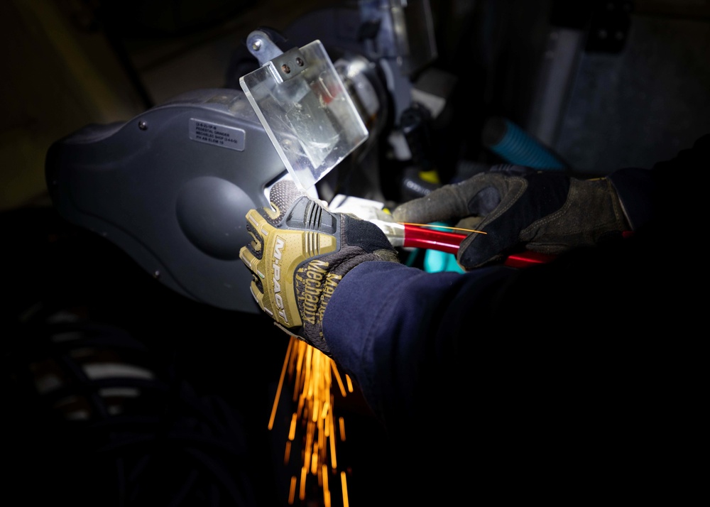 U.S. Navy Sailor Conducts Metal Work in the Oil Lab on USS Sioux City