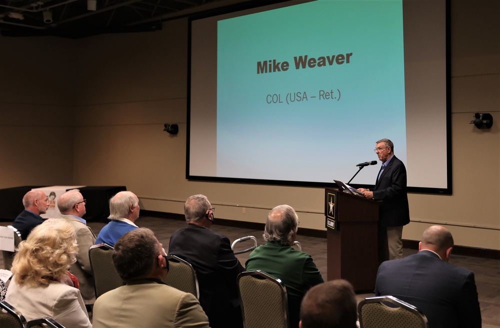 Retired Col. Mike Weaver speaks at WWII barracks grand opening