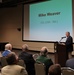 Retired Col. Mike Weaver speaks at WWII barracks grand opening