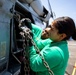 U.S. Navy Sailors Assigned to USS Sioux City and HSC 22 Chock and Chain Helicopter