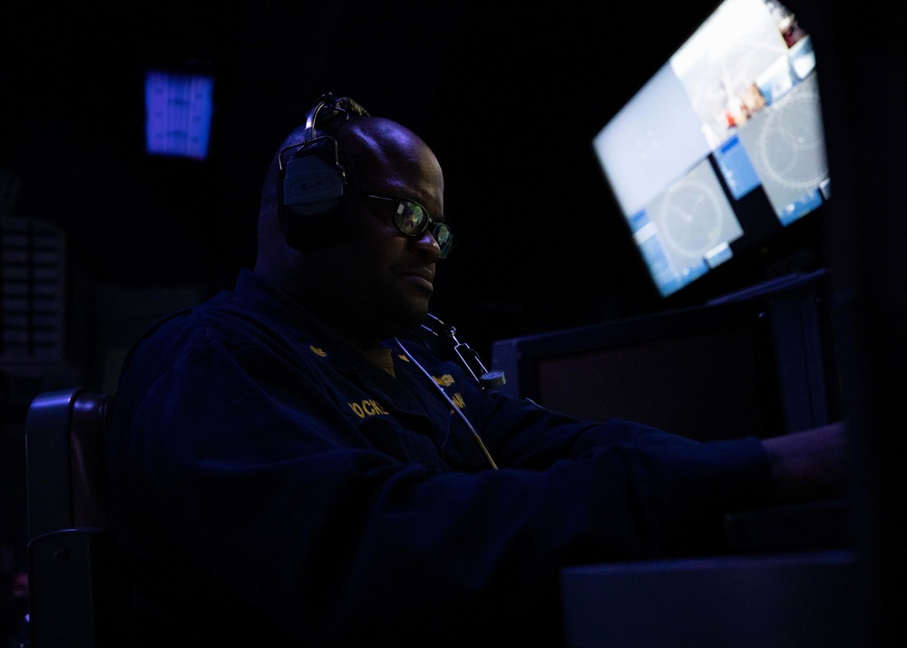 U.S. Navy Officer Assigned to USS Sioux City Stands Watch