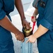 U.S. Navy Sailors Assigned to USS Sioux City Stow Ammunition