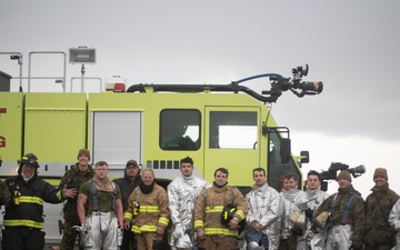 15th MEU expeditionary firefighting and rescue Marines work alongside local firefighters during real-world aircraft recovery