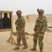 Task Force Spartan Soldiers share a moment of comradery at small arms competition