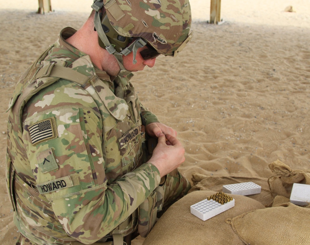 A Task Force Spartan Soldier loads magazine for SIG SAUER M17 during the TF Spartan small arms competition