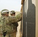 Task Force Spartan Soldiers check targets after firing at small arms competition