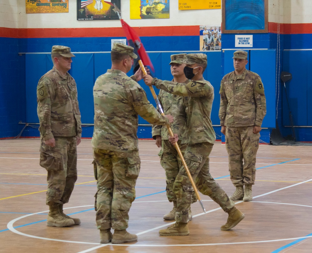 Capt. Benjamin Smith, Task Force Spartan, passes guidon during change of command