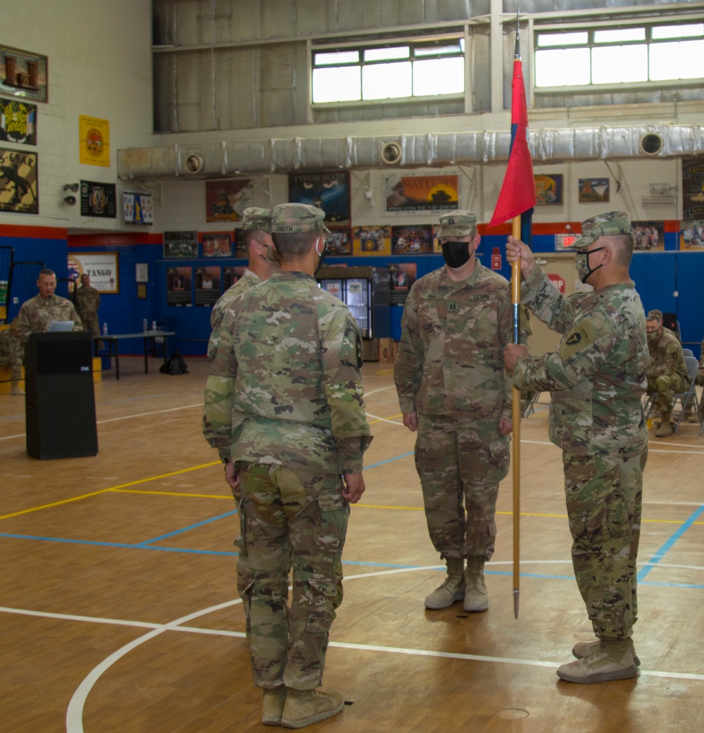 1st Sgt. Abel Nasser holds guidon after change of command