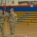 Capt. Russell Hall passes guidon after taking command of company at change of command ceremony