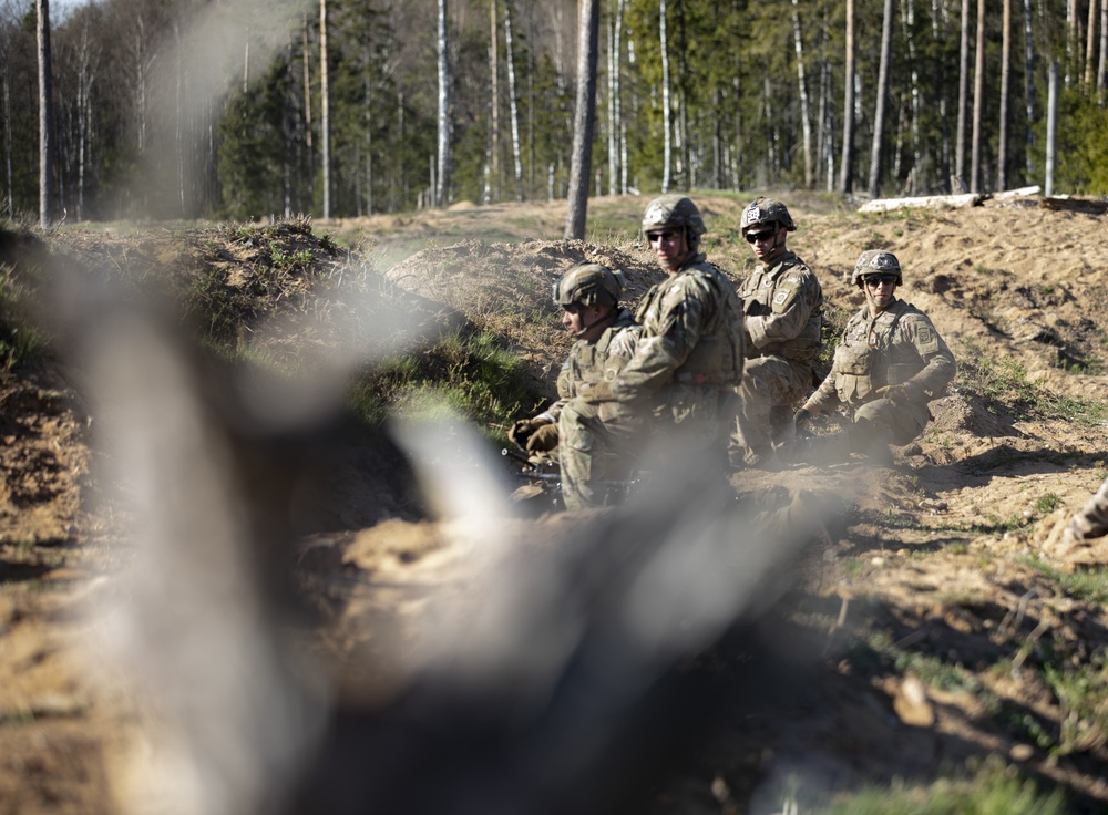 Soldiers gather for next brief.