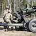 Soldier loads a 105 mm in the chamber